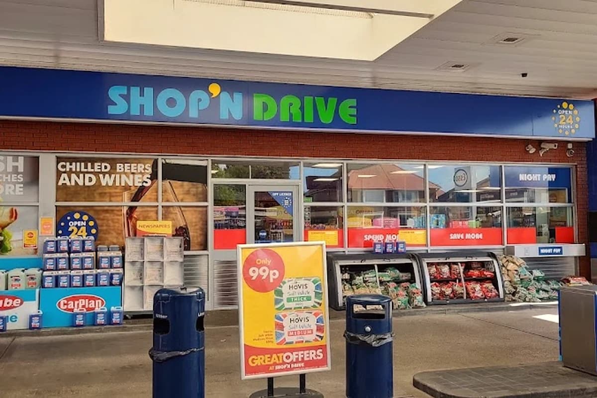 General retail convenience counter with shelves, cashier and barcode checkout