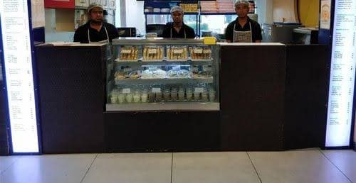 Fast-food order counter with touchscreen POS and menu items