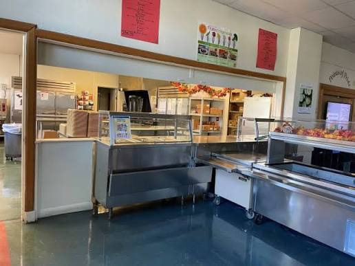 School canteen counter with snacks and drinks shelves